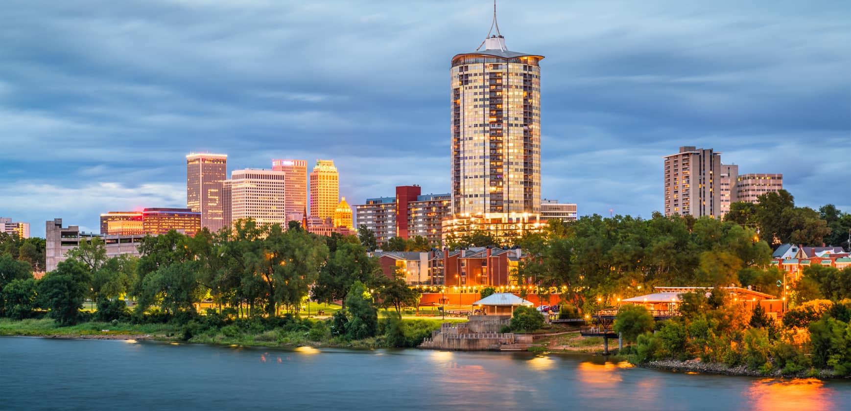 an evening city skyline image of Tulsa Oklahoma with overcast skies