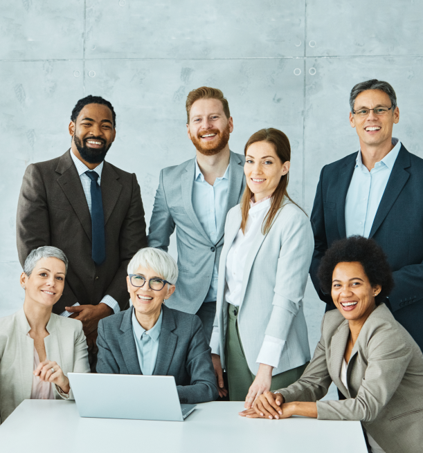 group of administrative professionals smiling at the camera