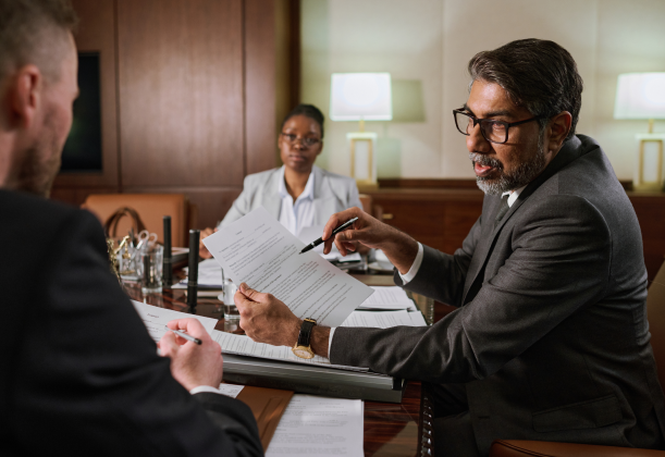 a case being discussed between a business owner and 2 attorneys